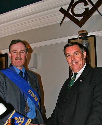 RWPGM Ramsay McGhee congratulates RWM Bruce Taylor on his installation